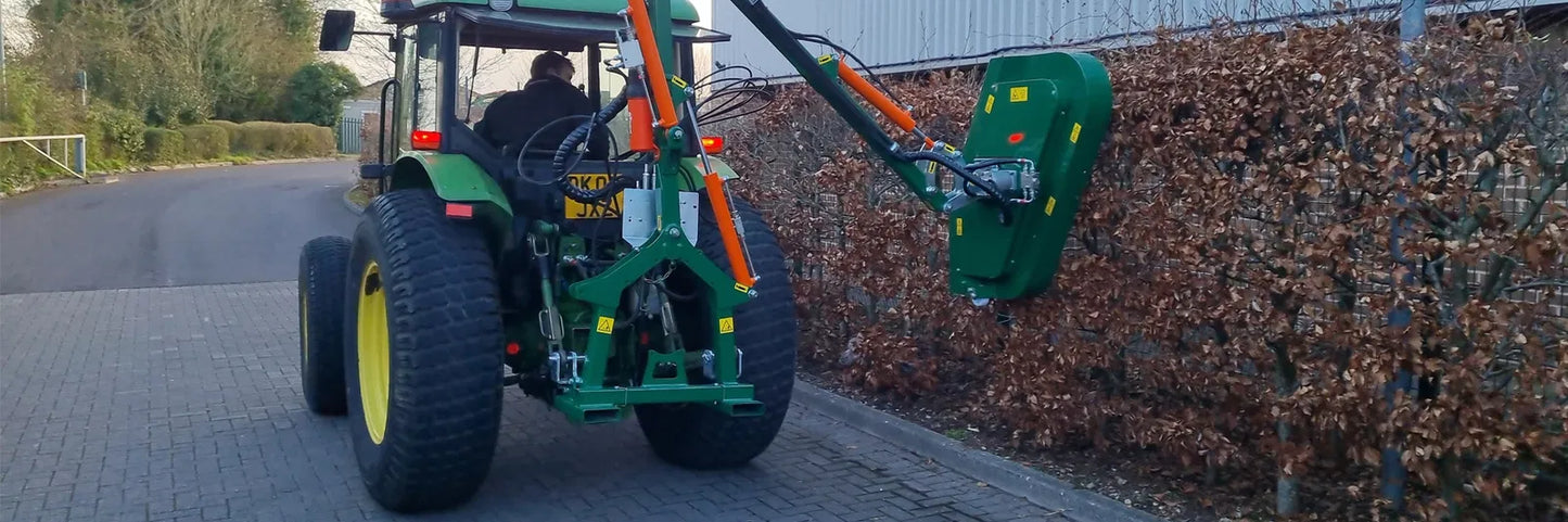 Tractor with a Wessex hedge cutter attached.