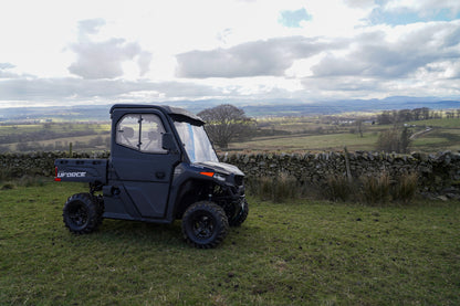 CFMOTO U600 UTV parked on grass with a scenic landscape in the background