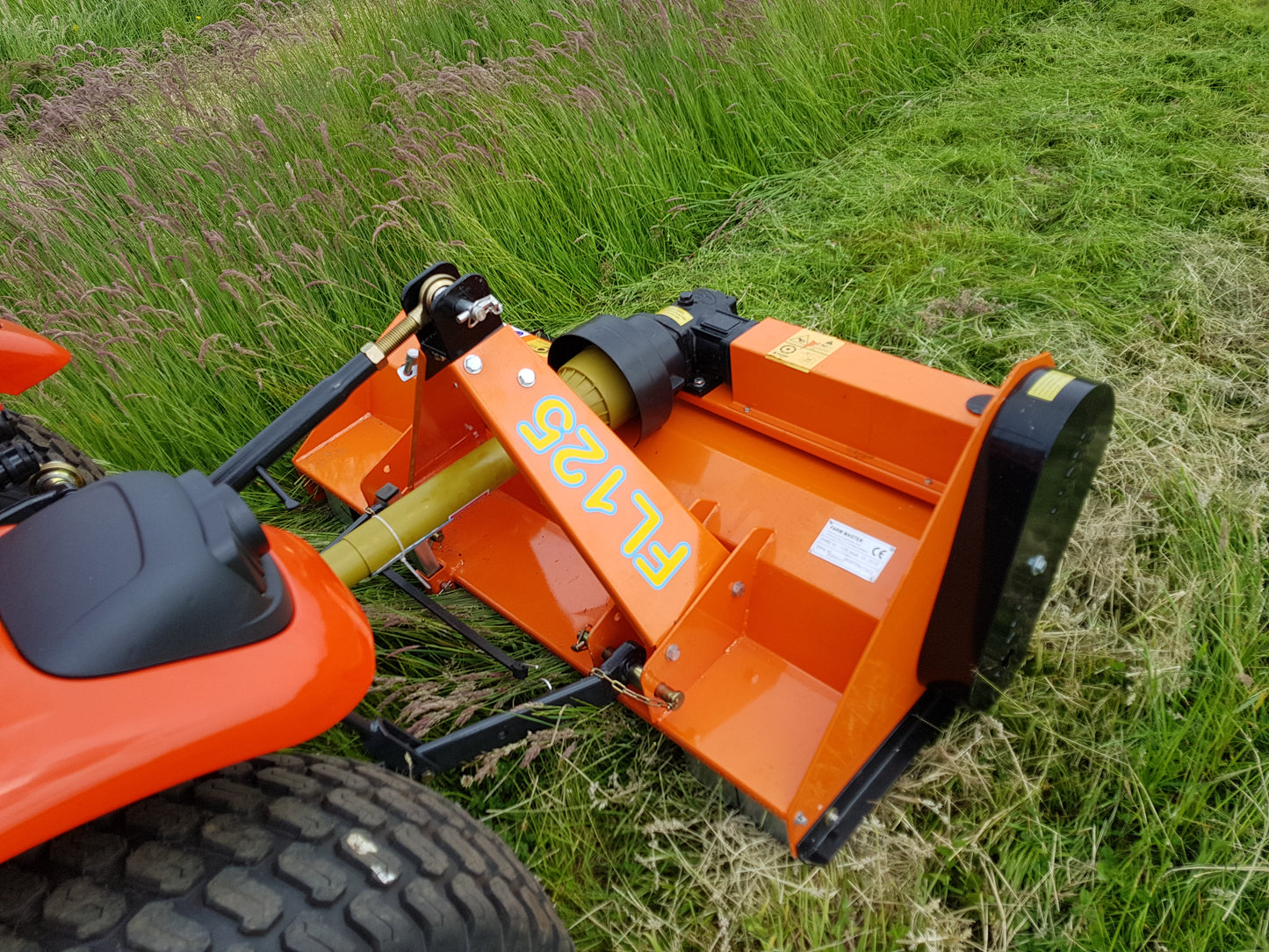 FarmMaster flail mower attachment on a grassy field