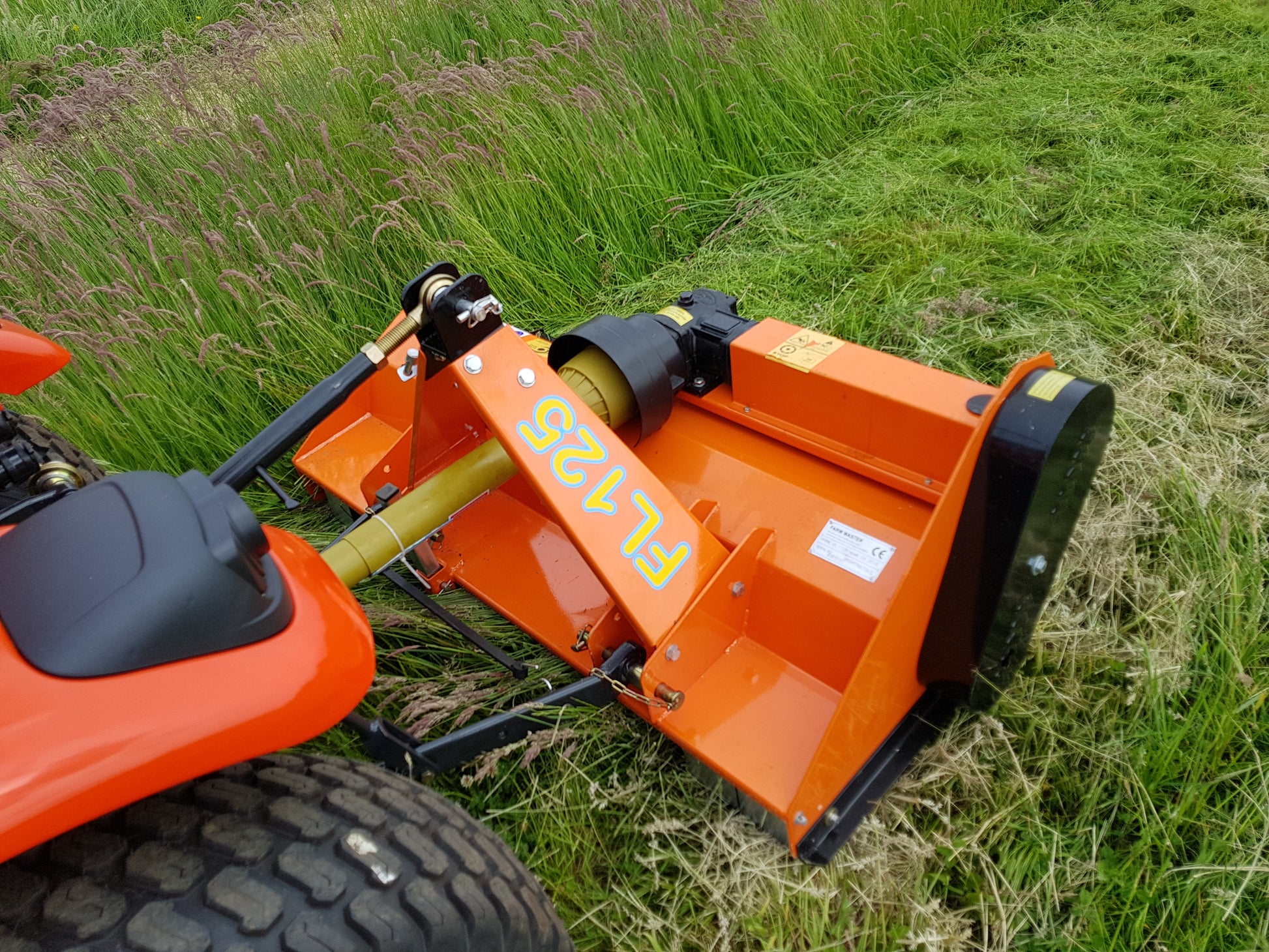 FarmMaster flail mower attachment on a grassy field