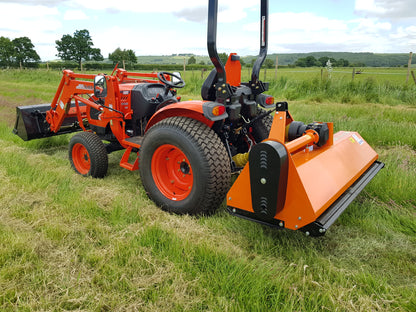Kioti tractor with FarmMaster tractor attachments in a grassy field
