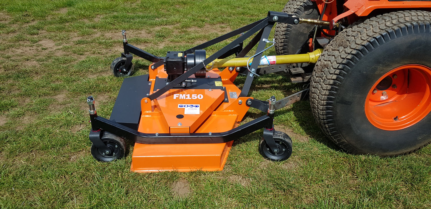 FarmMaster finishing mower attachment on a tractor in a grassy field