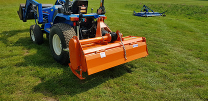 Orange FarmMaster tractor rotavator