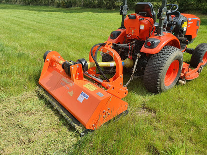 Orange tractor with a large FarmMaster flail mower attachment on a grassy field