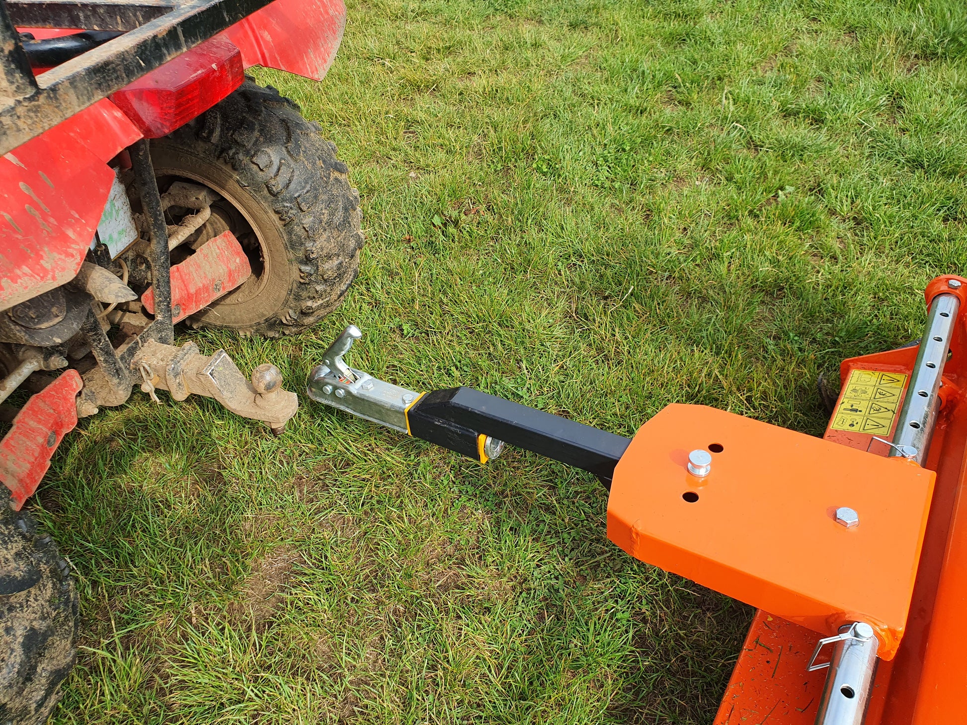 Ball hitch attached to a FarmMaster ATV flail mower