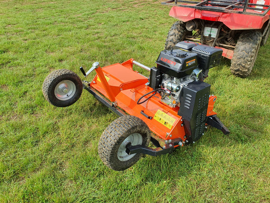 FarmMaster ATV flail mower on grass with a red ATV in the background