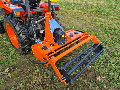 FarmMaster power harrow on a tractor in a field