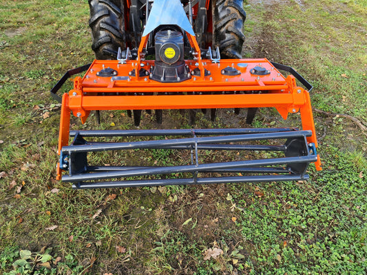 FarmMaster power harrow on a grassy field
