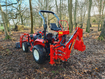 Red tractor with FarmMaster LandLugger tractor backhoe in a forest setting