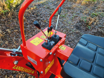 Close-up of a FarmMaster LandLugger tractor backhoe