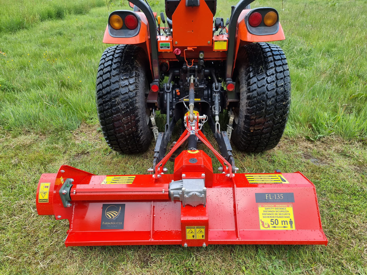 FarmMaster Pro flail mower attached to a tractor on grass