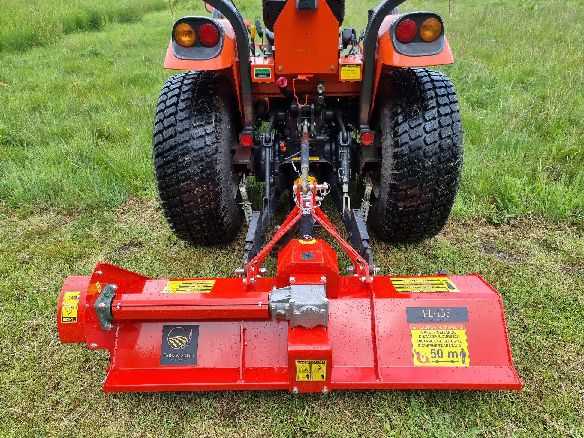 FarmMaster Pro flail mower attached to a tractor on grass