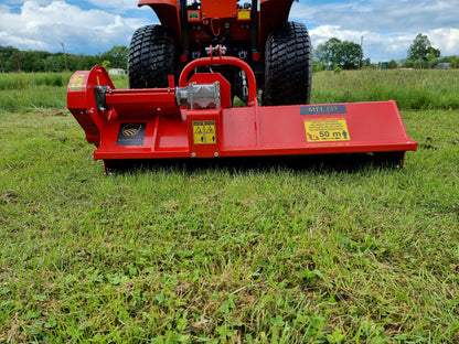 FarmMaster Pro Side-Shift flail mower on a grassy field with a cloudy sky