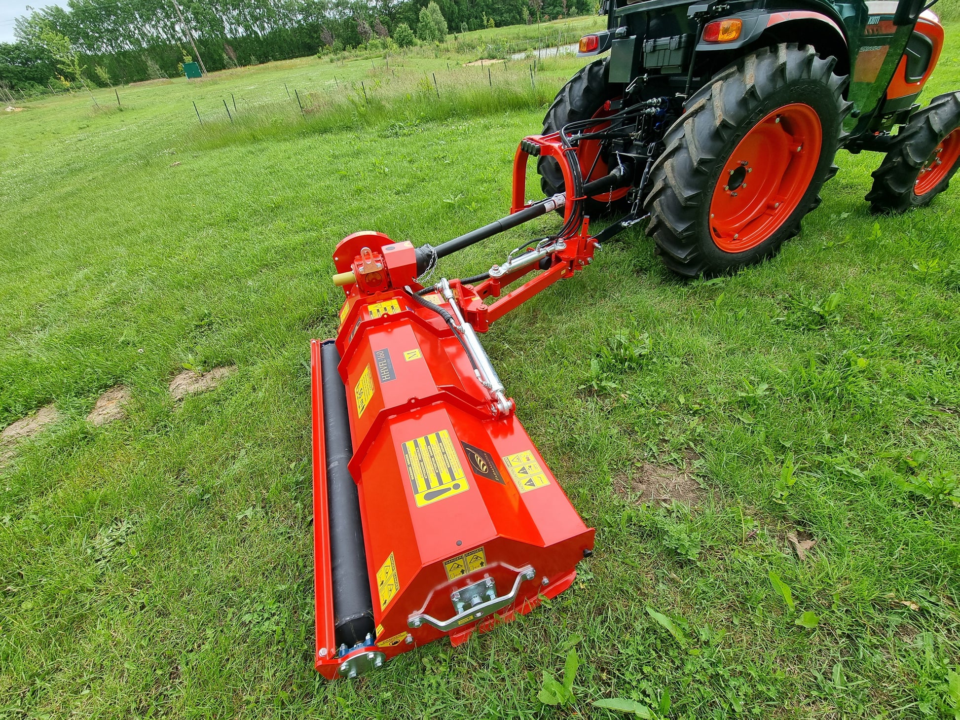 FarmMaster Pro Verge Flail Mower attached to a tractor in a field