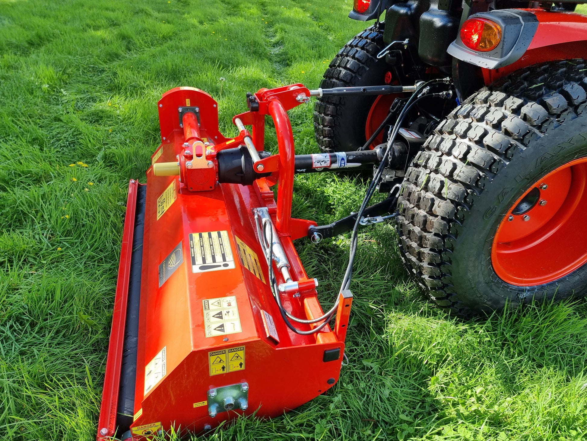 FarmMaster Pro flail mower attached to a tractor on grass