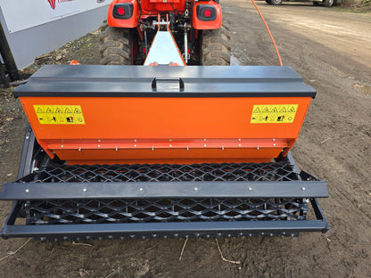 FarmMaster stone burier with seeder on a dirt road