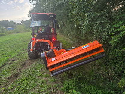 Tractor with a large FarmMaster Verge Flail Mower attachment cutting through grass and bushes