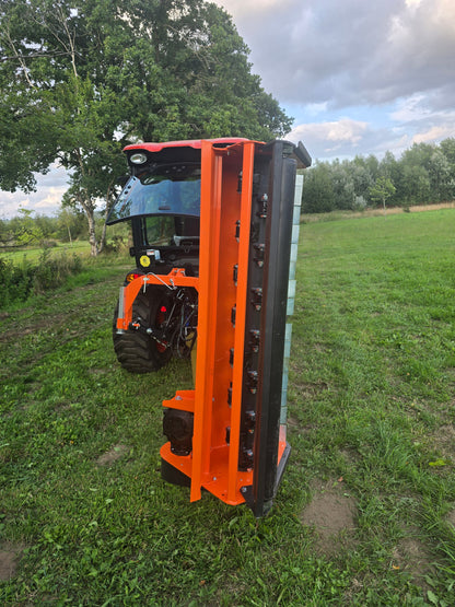 FarmMaster Verge Flail Mower on grass with trees in the background