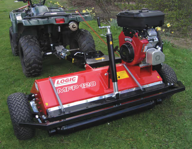 Logic ATV flail mower attached to an ATV on grass