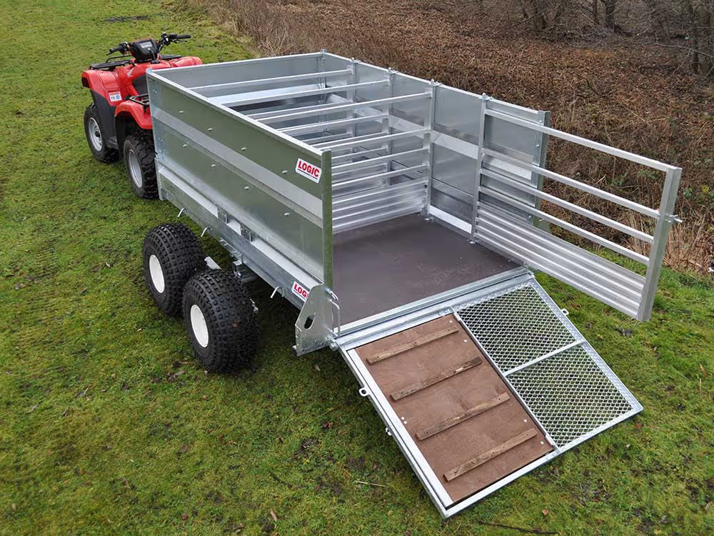 Logic ATV Trailer on grass, with a red ATV in the background.