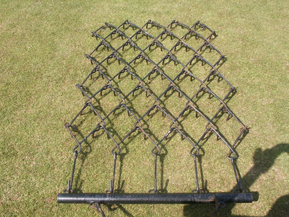 Chain harrow on a grassy background