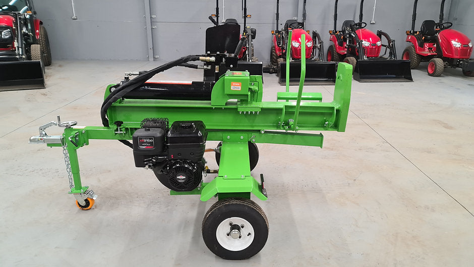 FarmMaster Goliath log splitter with other equipment in the background.