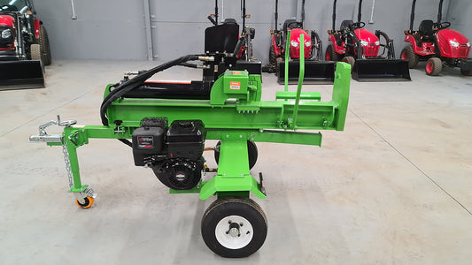 FarmMaster Goliath log splitter with other equipment in the background.