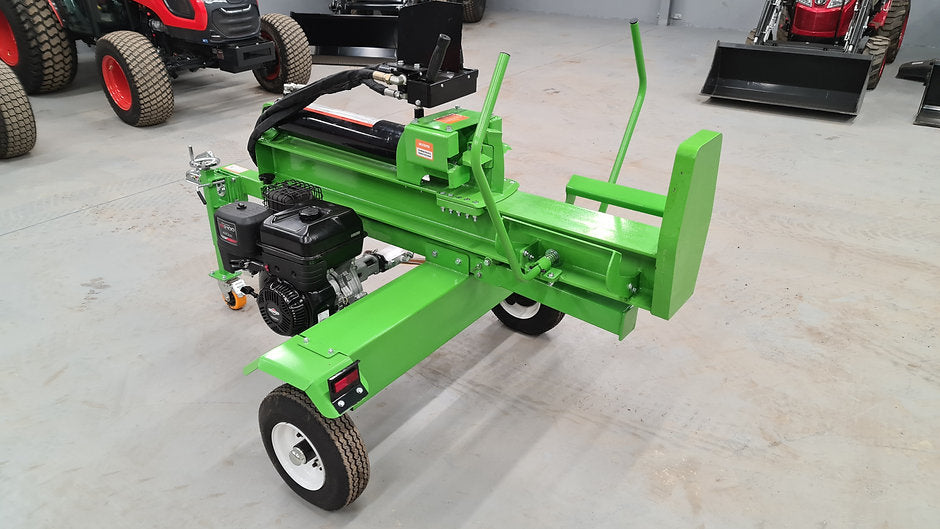 FarmMaster Goliath log splitter on a concrete floor with tractors in the background