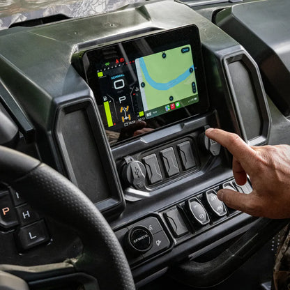 Person interacting with a touchscreen display in a CFMOTO UTV dashboard