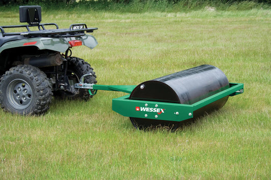 Wessex land roller attached to an ATV on a grassy field