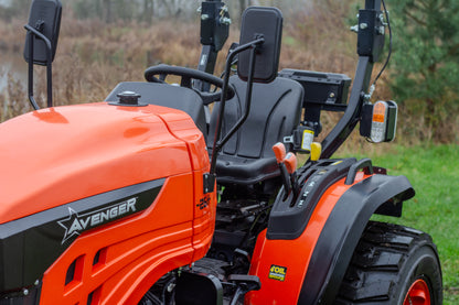 Avenger 26 compact tractor with black seat and mirrors in a field setting