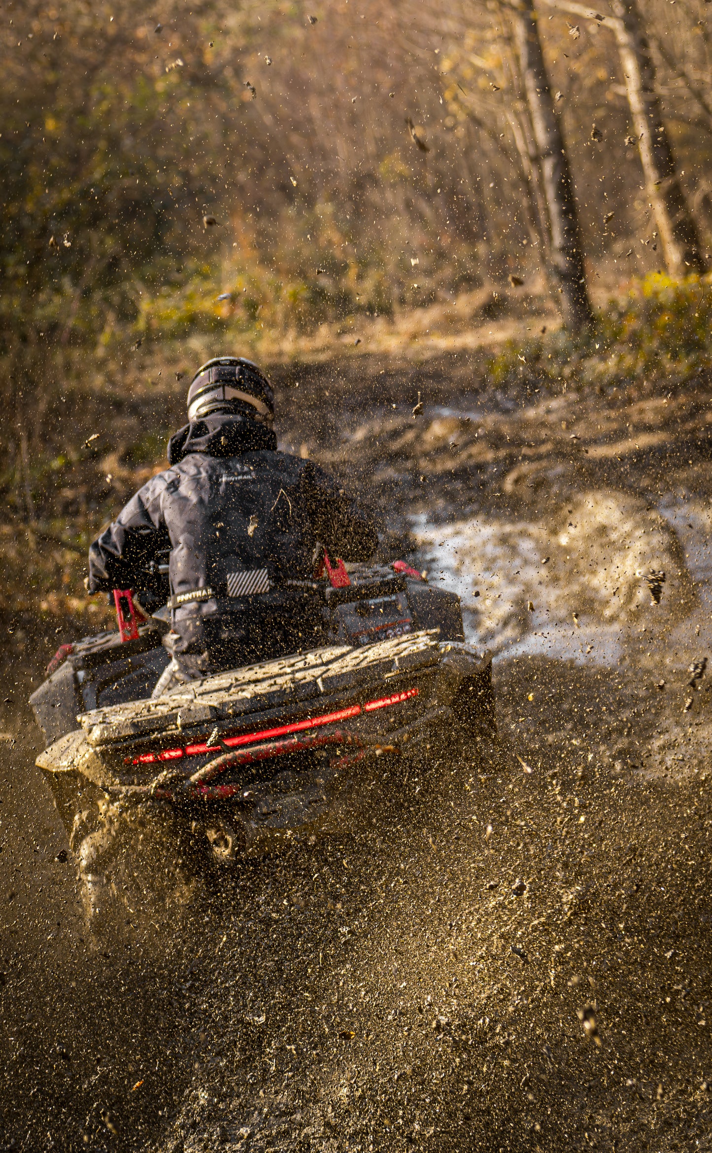 Person driving a CFMOTO 1000 MV  through a muddy field