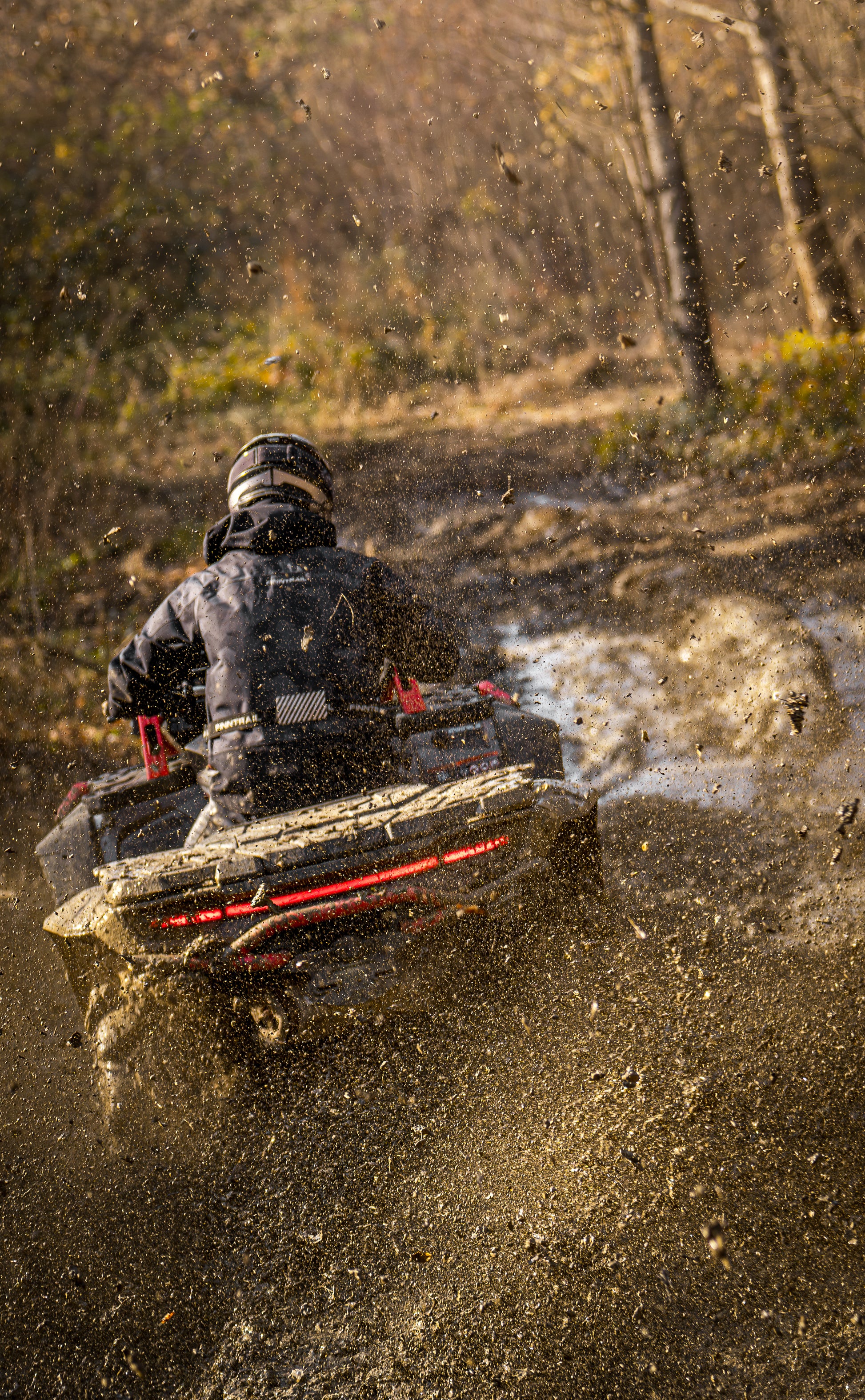 Person driving a CFMOTO 1000 MV  through a muddy field