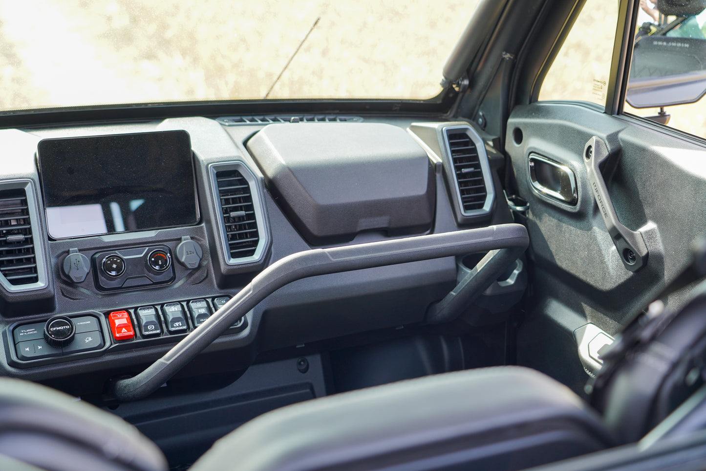 Close-up of a CFMOTO UTVs interior dashboard.