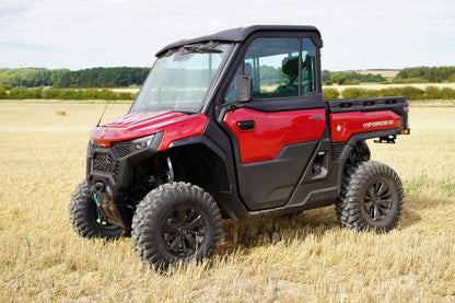 Red CFMOTO U10 Pro UTV in a field with a clear sky