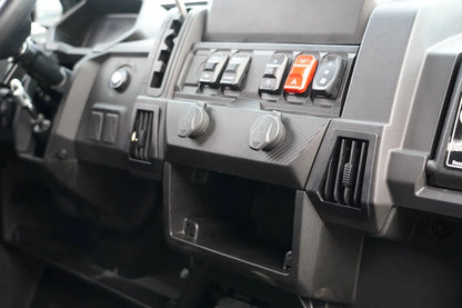 Close-up of CFMOTO UFORCE 600 Highland UTV dashboard with control buttons and switches.