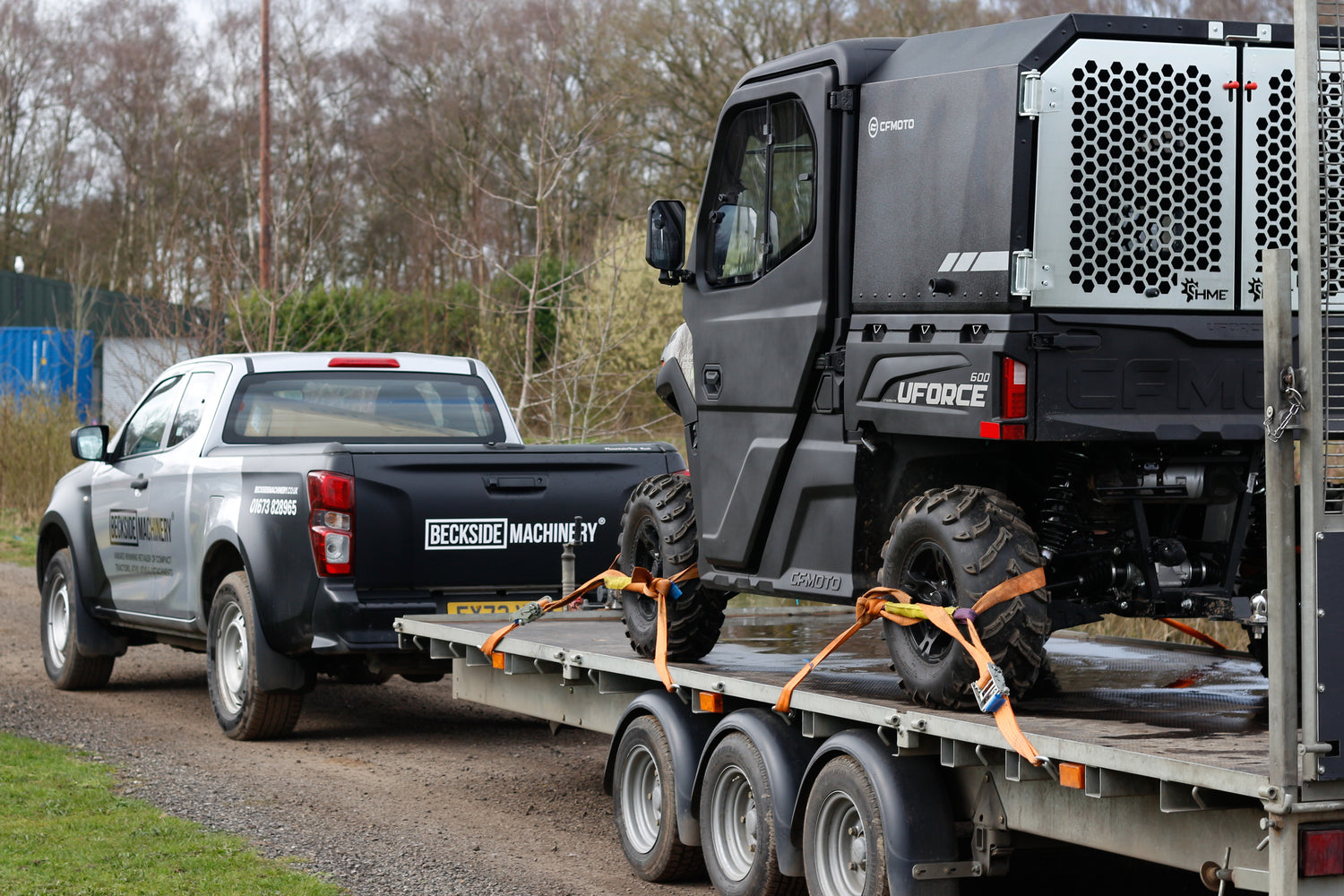 Beckside Machinery pick up towing a trailer with a CFMOTO UTV.