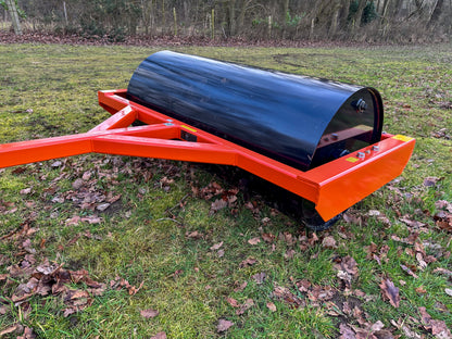 FarmMaster land roller in a grassy area with leaves.
