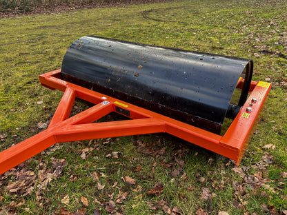 FarmMaster ATV land roller on a grassy field with leaves