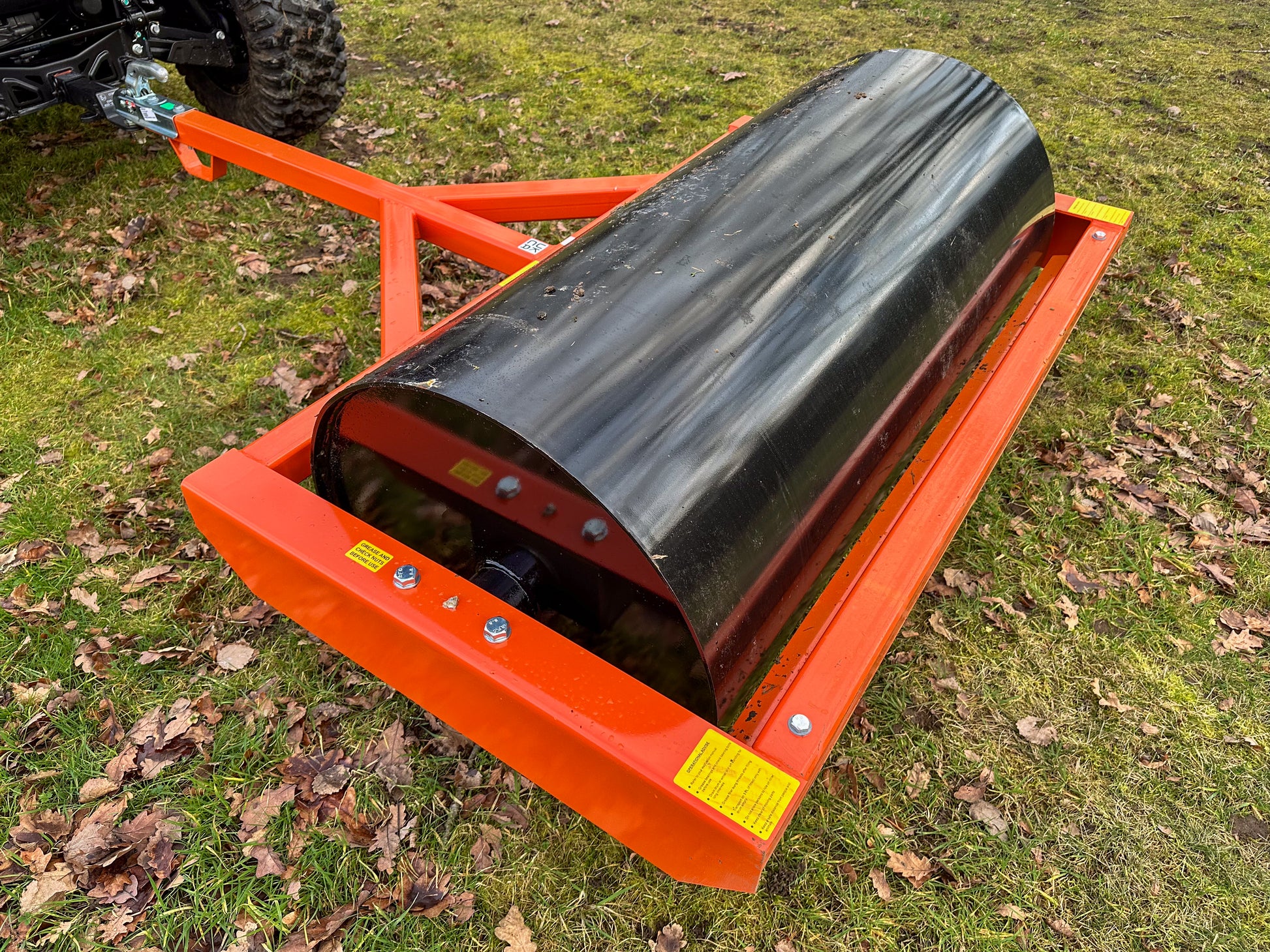 FarmMaster ATV land roller on grass with leaves