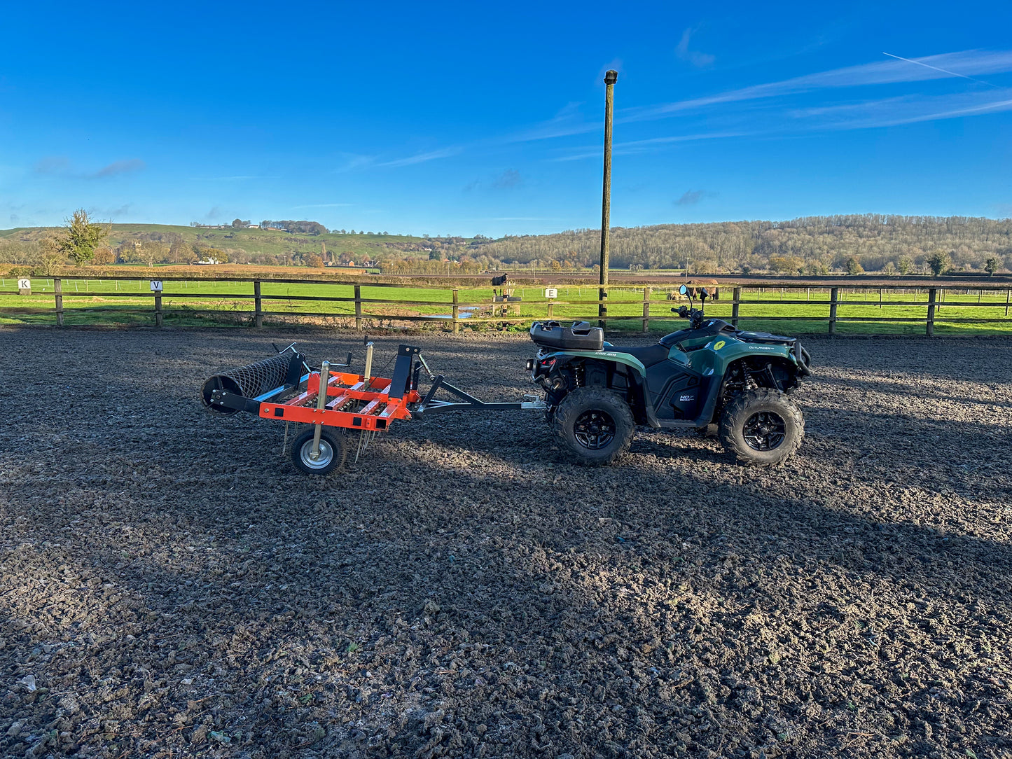 Can-Am ATV with a FarmMaster ATV arena conditioner