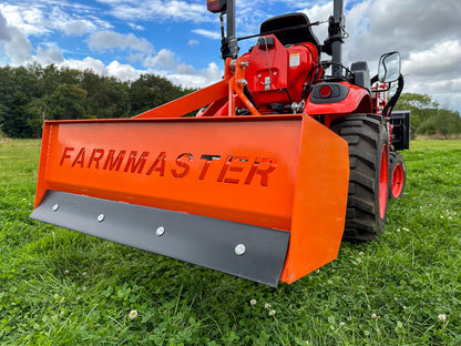  FarmMaster tractor box grader attachment on a grassy field.