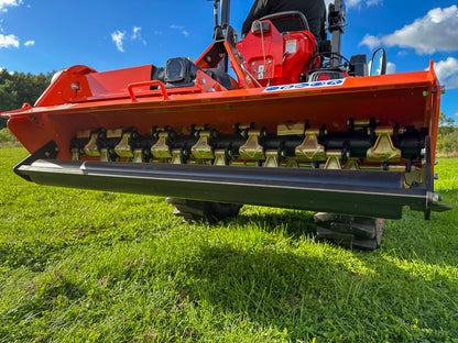 FarmMaster Flail Mower on a grassy field with a blue sky.
