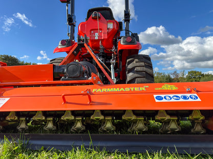 FarmMaster flail mower against a blue sky.