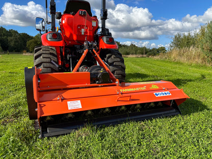 Kioti tractor with a FarmMaster flail mower attachment on a grassy field