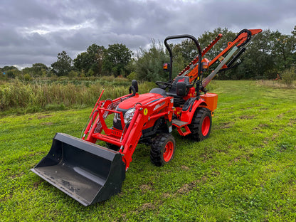 FarmMaster tractor hedge cutter on a grassy field