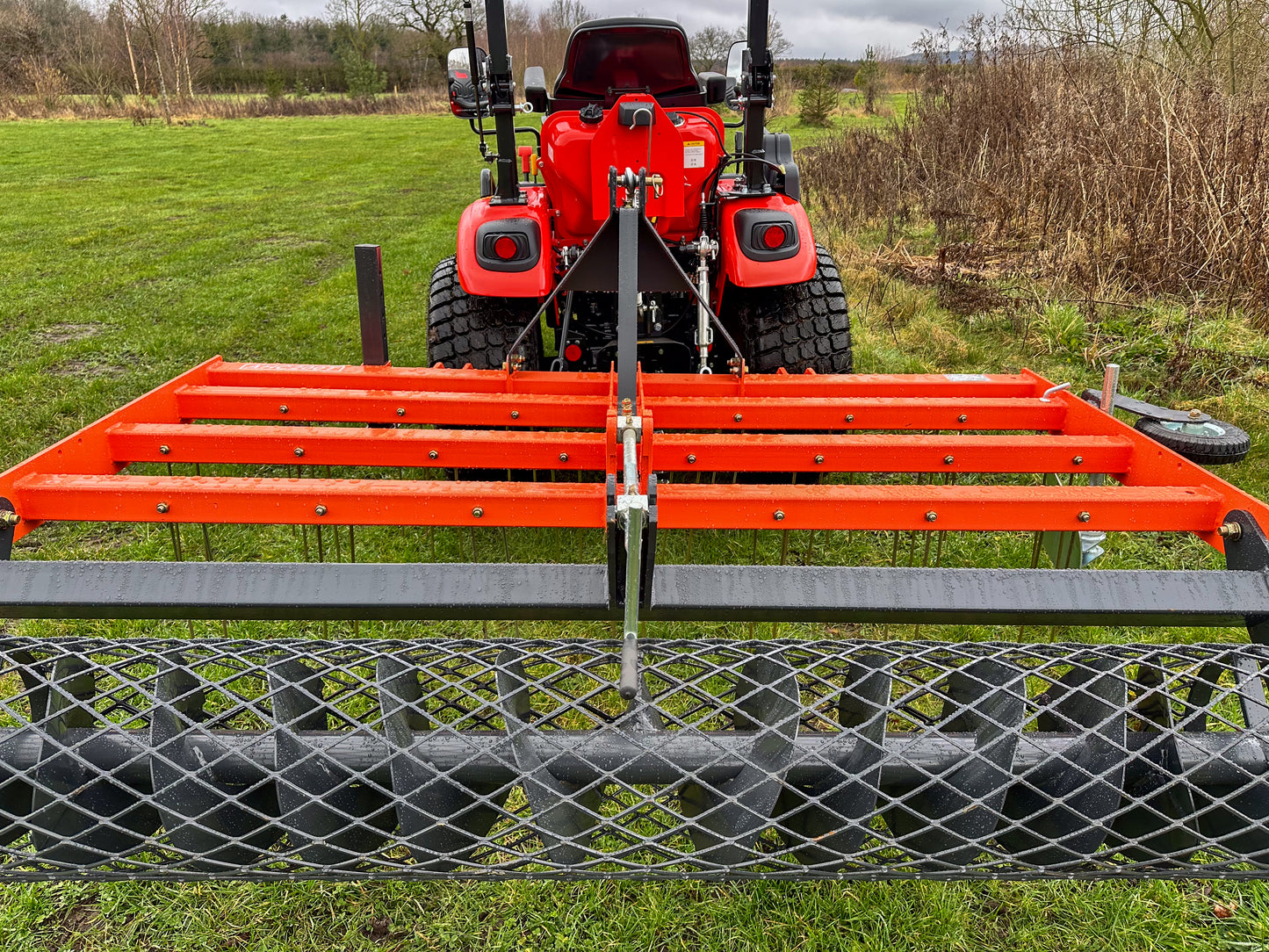 Kioti tractor with a FarmMaster tractor arena conditioner
