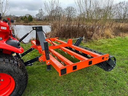 Kioti tractor with an attached FarmMaster tractor arena conditioner