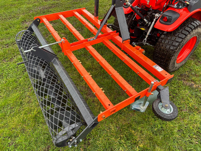 FarmMaster tractor arena conditioner attached to a tractor on grass