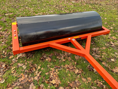 FarmMaster tractor land roller in a grassy area with fallen leaves.